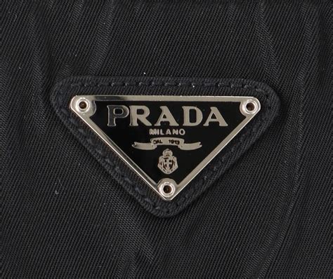 Is it normal an authentic Prada bag's triangle logo not